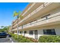 Charming condo building featuring multiple floors and a well-manicured landscape at 6070 80Th N St # 104, St Petersburg, FL 33709