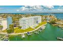 Amazing aerial view of condo complex with boat docks and a resort-style community pool at 610 Island Way # 302, Clearwater Beach, FL 33767