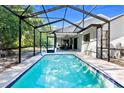 Inviting screened-in pool area, perfect for relaxation and entertaining at 13501 Whitby Rd, Hudson, FL 34667