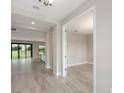Inviting foyer with tile floors leads to the spacious living area and kitchen at 14403 Woodland Spur Dr, Lithia, FL 33547