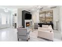 Inviting living room with a cozy fireplace and a neutral color palette at 260 Moccasin Hollow Rd, Lithia, FL 33547