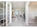 Bright and airy living room showcasing marble tile flooring and an open floor plan at 260 Moccasin Hollow Rd, Lithia, FL 33547