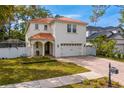 Beautiful two-story home with red tile roof, manicured lawn, and brick driveway at 4310 W Sevilla St, Tampa, FL 33629