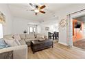 Bright living area with a comfortable sectional sofa and an adjacent dining space at 12762 98Th St, Largo, FL 33773