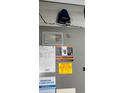 Close up of the HVAC system with a UV light system and warning labels at 14050 Arbor Pines Dr, Riverview, FL 33579