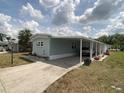 Charming home with a long carport, garden bed and well-kept exterior at 1710 7Th Sw St # 24, Ruskin, FL 33570