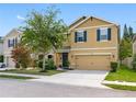 Charming two-story home with a well-maintained lawn, inviting curb appeal, and a spacious driveway at 5946 81St N Ave, Pinellas Park, FL 33781