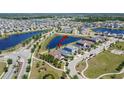 Aerial view of neighborhood showcasing property near community lakes and amenities at 7215 Wash Island Dr, Sun City Center, FL 33573