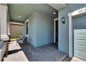 Covered porch with brick accents and recessed lights provide a welcoming entrance to this home at 7215 Wash Island Dr, Sun City Center, FL 33573