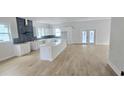Spacious kitchen with modern white cabinets, a large island, and stainless steel appliances at 745 31St N Ave, St Petersburg, FL 33704
