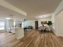Spacious open floor plan with updated kitchen, dining area, and cozy living room at 10408 N 50Th St # 1/2, Tampa, FL 33617