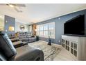 Comfortable living room with a plush seating, neutral-toned rug, and bright natural light at 109 W Saint Lucia Loop, Apollo Beach, FL 33572