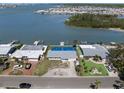 Aerial view of waterfront homes showcasing docks and community's proximity to the water at 11533 48Th N Ave, St Petersburg, FL 33708