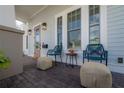 Charming covered porch featuring comfortable seating and stylish decor, perfect for relaxing outdoors at 1550 48Th N Ave, St Petersburg, FL 33703