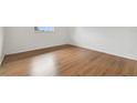 Bright bedroom with new hardwood floors and a window at 200 Country Club Dr # 308, Largo, FL 33771