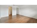 Hardwood floors in this bright bedroom with two doorways at 200 Country Club Dr # 308, Largo, FL 33771