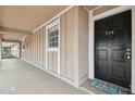 Exterior front door with number and Welcome mat at 200 Country Club Dr # 308, Largo, FL 33771