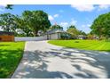 Lovely curb appeal with a concrete driveway, manicured lawn and beautiful exterior at 22304 Stillwood Dr, Land O Lakes, FL 34639