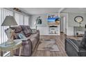 Cozy living room features comfortable seating, stylish decor, and plenty of natural light at 2331 Belleair Rd # 214, Clearwater, FL 33764