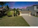 Charming single-Gathering home with lush tropical landscaping and a two-car garage at 2510 Cross More St, Valrico, FL 33594