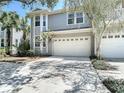 Charming two-story home featuring a two-car garage and well-maintained landscaping at 2874 Bayshore Trails Dr, Tampa, FL 33611