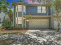 Charming two-story home featuring a two-car garage and well-maintained landscaping at 2874 Bayshore Trails Dr, Tampa, FL 33611