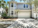 Charming two-story home featuring a two-car garage and well-maintained landscaping at 2874 Bayshore Trails Dr, Tampa, FL 33611