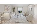 Bright living room with neutral tones, stylish furnishings, and a large window with natural light at 330 47Th N Ave, St Petersburg, FL 33703