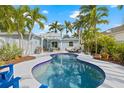 Backyard with a pristine pool, seating area and lush landscaping creating a private retreat at 330 47Th N Ave, St Petersburg, FL 33703