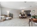 Open-concept living and dining area with stylish decor and plenty of natural light at 4417 W Fair Oaks Ave, Tampa, FL 33611