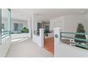 Charming condo featuring a private entrance, balcony, and lush landscaping at 4750 Dolphin Cay S Ln # 209, St Petersburg, FL 33711