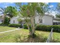 Charming single-story home with a well-kept front yard, fenced perimeter, and a lovely tree adding to the landscape at 5148 3Rd N Ave, St Petersburg, FL 33710
