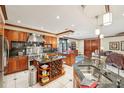 Expansive kitchen with stainless steel appliances, dual islands, a wine rack, and open access to the living space at 515 Orange St, Palm Harbor, FL 34683