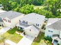 Aerial view of a well-maintained home showcasing the roof and landscaping in a residential neighborhood at 626 Diamond Ridge Rd, Seffner, FL 33584