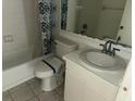 Well-lit bathroom featuring a vanity, toilet and shower/tub combination at 6304 Pointe West Blvd # A206, Bradenton, FL 34209