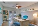 Bright home office with built-in shelving and French doors leading to the outdoor space at 6513 14Th W Ave, Bradenton, FL 34209