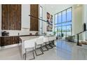 Modern kitchen featuring a large island, floor-to-ceiling cabinetry, and an open floor plan at 88 Avonwood, Tampa, FL 33625