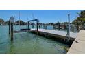 A well-maintained boat lift and dock offer easy access to the water, perfect for boating enthusiasts at 14043 E Parsley Dr, Madeira Beach, FL 33708