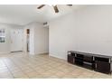 Spacious living room showcasing tile floors and an open layout to the kitchen at 1552 Pleasant Rd # J4, Bradenton, FL 34207