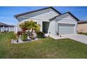 Attractive single-Gathering home with a two-car garage and well-manicured lawn, complete with landscape beds at 2232 Harris Hawk, Ruskin, FL 33570