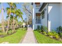 Paver walkway lined with lush landscaping and a mailbox leading to the entrance of the home at 526 39Th S Ave, St Petersburg, FL 33705
