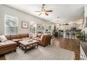Spacious living room with modern decor, a large leather sofa, and lots of natural light at 7606 S Sparkman St, Tampa, FL 33616
