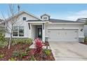Charming home with modern curb appeal and meticulously maintained landscaping at 8706 Arrow Creek Dr, Parrish, FL 34219