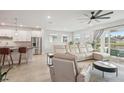 Bright and inviting living room with stylish furniture and backyard views at 8706 Arrow Creek Dr, Parrish, FL 34219