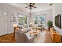 Cozy living room features natural light, hardwood floors, and stylish furniture at 933 E Shadowlawn Ave, Tampa, FL 33603