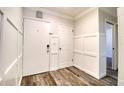Bright entryway featuring modern wood-look floors and decorative wainscoting at 1111 N Bayshore Blvd # E3, Clearwater, FL 33759
