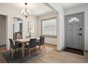 Inviting dining room with wood floors, modern lighting, and neutral colors, perfect for Gathering meals at 2125 Acorn S Pl, St Petersburg, FL 33712