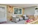 Charming front porch with comfortable seating and decorative flower box at 5248 Coral N Way, St Petersburg, FL 33714