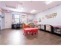Bright and airy playroom featuring multiple learning stations and tables, perfect for education and fun at 810 W Whatley Pl, Tampa, FL 33604