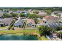 A charming single-Gathering home features a fenced yard and a serene lake view at 10108 36Th E Ct, Parrish, FL 34219